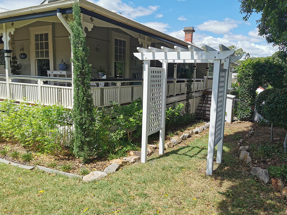 This Pine Arbour has been painted white to compliment the style and features of this 1915 Queenslander house in Indooroopilly.