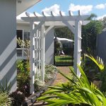 This lovely arbour sits over a pathway leading to the backyard.