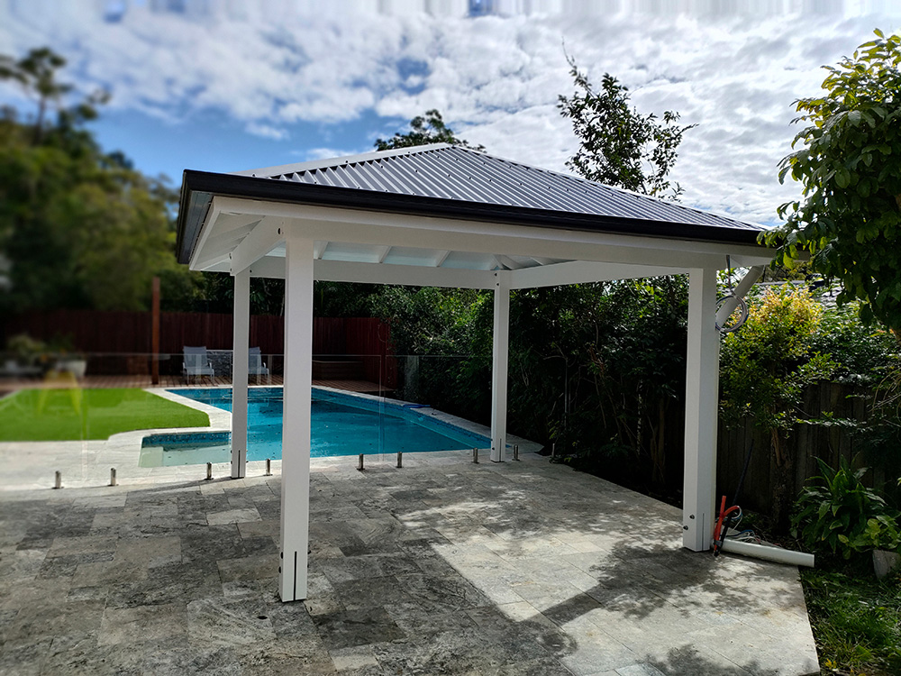 This painted Pine White Gazebo looks just beautiful with the Monument Colorbons roof and gutter.