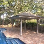 Gazebo set into existing pool surround. Painted Gazebo with hardwood posts concreted in ground.