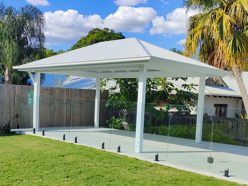 This lovely white Gazebo looks beautiful beside the pool and large lawn at this residence in Sherwood, QLD.