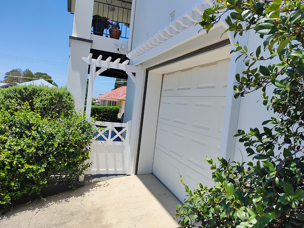 This little Eyebrow Pergola sits just above the garage door and it looks fantastic on this side wall of the residence.