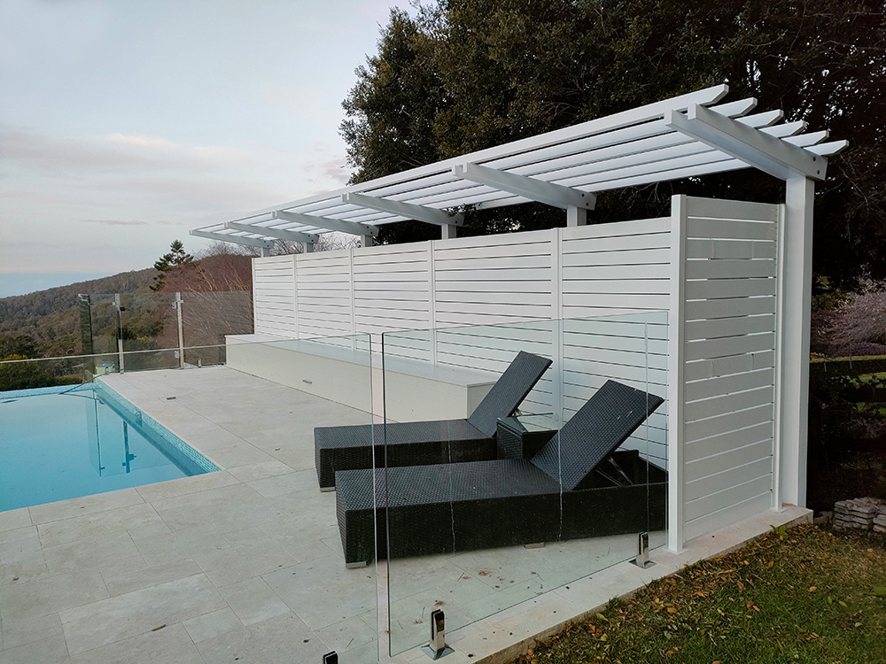 The Pergola is set to sit just above the existing pool fence screening that was installed at the end of the pool.