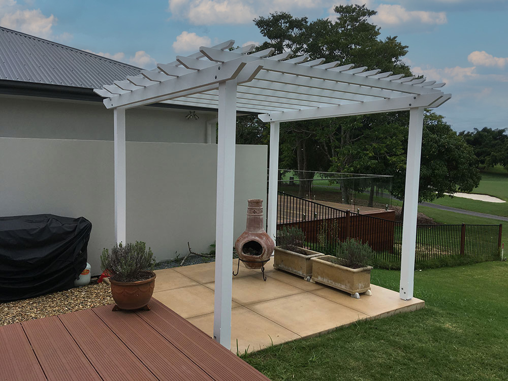 Painted timber pergola attached to existing cement slab.