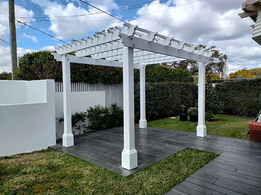 This lovely white Pergola has a Scotia profile that matches existing Pergole Profiles in the window boxes.